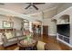 Spacious living room showcasing an open layout, hardwood floors, and a view of the kitchen at 14709 Coral Berry Dr, Tampa, FL 33626