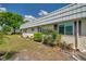 Charming single-story home exterior with well-maintained landscaping and dark brown shutters at 1801 Bedford Ter # 221, Sun City Center, FL 33573