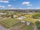 Community recreation area showcasing lawn bowling amenities, manicured lawns and gardens under a sunny sky at 1801 Bedford Ter # 221, Sun City Center, FL 33573