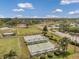 Aerial view of the community's outdoor recreation area featuring lawn bowling and well-kept landscaping near the condos at 1801 Bedford Ter # 221, Sun City Center, FL 33573