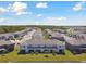 Overhead image of townhome community near lake at 1869 Hovenweep Rd, Wesley Chapel, FL 33543