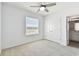 Bright bedroom with a ceiling fan, closet, and natural light at 1869 Hovenweep Rd, Wesley Chapel, FL 33543