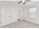 Cozy bedroom with neutral colors, carpet, and a closet at 1869 Hovenweep Rd, Wesley Chapel, FL 33543