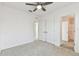 Cozy bedroom with neutral colors, carpet, and a ceiling fan at 1869 Hovenweep Rd, Wesley Chapel, FL 33543