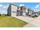 This home boasts an attached garage, manicured lawn, and car parked in driveway at 1869 Hovenweep Rd, Wesley Chapel, FL 33543