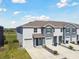 This is an aerial view of the homes with well-maintained lawns at 1869 Hovenweep Rd, Wesley Chapel, FL 33543