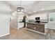 A lovely kitchen with stainless appliances, stylish countertops, and a center island at 1869 Hovenweep Rd, Wesley Chapel, FL 33543