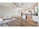 Bright living area with hardwood floors connecting the kitchen and living room space at 1869 Hovenweep Rd, Wesley Chapel, FL 33543