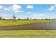 Pond view in residential community at 1869 Hovenweep Rd, Wesley Chapel, FL 33543