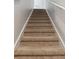 Carpeted staircase leading to the upper levels of the home at 1869 Hovenweep Rd, Wesley Chapel, FL 33543