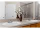Bathroom with double sinks and neutral tile throughout at 200 Fairmont Dr, Spring Hill, FL 34609