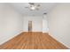 Spacious bedroom with hardwood floors and open doorway to en-suite bathroom at 200 Fairmont Dr, Spring Hill, FL 34609