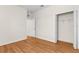 Bright bedroom features wood-look floors, neutral walls, and a spacious closet at 200 Fairmont Dr, Spring Hill, FL 34609