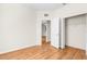 Open bedroom with hardwood floors and closet at 200 Fairmont Dr, Spring Hill, FL 34609