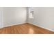 Bedroom with hardwood floors and a large window at 200 Fairmont Dr, Spring Hill, FL 34609