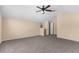 Spacious bonus room featuring neutral walls, plush carpet, and a ceiling fan at 200 Fairmont Dr, Spring Hill, FL 34609