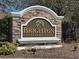 Brighton Place community sign with stone accents and manicured landscaping at 200 Fairmont Dr, Spring Hill, FL 34609