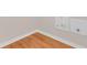 Corner detail of hardwood floors and modern trim at 200 Fairmont Dr, Spring Hill, FL 34609