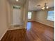 Inviting foyer with tile flooring, flowing into a spacious living area featuring hardwood floors at 200 Fairmont Dr, Spring Hill, FL 34609