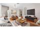 Comfortable living room with stylish decor, hardwood floors, and ample space for entertaining at 200 Fairmont Dr, Spring Hill, FL 34609
