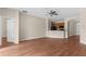 Living room with hardwood floors and a view of kitchen area at 200 Fairmont Dr, Spring Hill, FL 34609