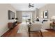Staged living room with hardwood floors with modern furniture at 200 Fairmont Dr, Spring Hill, FL 34609