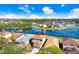 Aerial view of a home nestled by a serene lake, surrounded by lush greenery and a peaceful neighborhood at 20631 Great Laurel Ave, Tampa, FL 33647