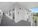Hallway leading to a condo with a private balcony overlooking the complex at 2428 Columbia Dr # 72, Clearwater, FL 33763