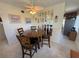 Cozy dining area features a round table, seating for four, and a stylish mirrored wall accent at 2428 Columbia Dr # 72, Clearwater, FL 33763