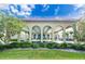 Property entrance featuring a covered portico with well-manicured landscaping at 2428 Columbia Dr # 72, Clearwater, FL 33763