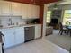 Bright kitchen features white cabinets and stainless steel appliances, offering style and convenience at 2428 Columbia Dr # 72, Clearwater, FL 33763