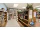 Cozy library with well-stocked bookshelves, plants, and comfortable ambiance for reading and relaxation at 2428 Columbia Dr # 72, Clearwater, FL 33763