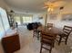 Open living and dining area featuring neutral carpet and natural lighting at 2428 Columbia Dr # 72, Clearwater, FL 33763