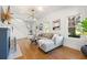 Bright living room with hardwood floors, a cozy gray sectional, and modern lighting fixtures at 2833 7Th N St, St Petersburg, FL 33704