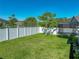 Spacious backyard featuring a trampoline and screened patio, perfect for outdoor activities at 30830 Birdhouse Dr, Wesley Chapel, FL 33545