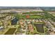 Aerial view of the community highlighting the beautiful homes, lush greenery, and serene ponds with a perfect location at 310 Cockle Shell Loop, Apollo Beach, FL 33572