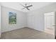 Bright bedroom with neutral carpet, white walls, and double closet at 310 Cockle Shell Loop, Apollo Beach, FL 33572