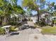 Charming townhome exterior with lush landscaping, manicured lawns, and a private driveway at 3205 W De Leon St # B, Tampa, FL 33609