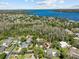 This aerial view reveals the property's desirable neighborhood near the lake and mature landscaping at 3267 Westcott Ct, Palm Harbor, FL 34684