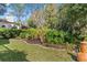 Manicured backyard features lush landscaping, a neat lawn, and privacy hedges, enhancing its appeal at 3267 Westcott Ct, Palm Harbor, FL 34684