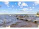 A private boat dock sits on the waterfront with access to beautiful views and boat slips at 3267 Westcott Ct, Palm Harbor, FL 34684