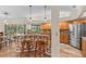 Open-concept kitchen featuring wooden cabinets, granite countertops, a tile backsplash and stainless steel appliances at 3267 Westcott Ct, Palm Harbor, FL 34684