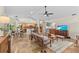 Spacious living area with travertine floors, seamless flow to kitchen, dining, and entertainment spaces at 3267 Westcott Ct, Palm Harbor, FL 34684