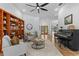 Open living room boasts travertine floors, natural light, and flows into the entry and dining area at 3267 Westcott Ct, Palm Harbor, FL 34684
