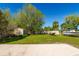 Sprawling backyard features lush green grass, a shed, a boat and plenty of room for outdoor activities at 3418 Cullendale Dr, Tampa, FL 33618