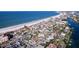 Gorgeous aerial view of beachfront homes, condos and commercial property along the shore at 3503 Casablanca Ave, St Pete Beach, FL 33706