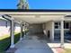 Carport with ample space for parking and storage, offering convenience and functionality at 3503 Casablanca Ave, St Pete Beach, FL 33706