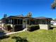 Charming home with manicured hedges and a well-maintained lawn at 3503 Casablanca Ave, St Pete Beach, FL 33706