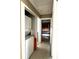 Hallway featuring a convenient stacked washer and dryer in a closet at 3503 Casablanca Ave, St Pete Beach, FL 33706