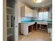 Kitchen with tiled countertops and window at 3503 Casablanca Ave, St Pete Beach, FL 33706